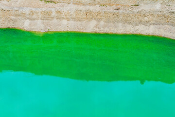 Lake formation in an old abandoned quarry. Quarry lake.