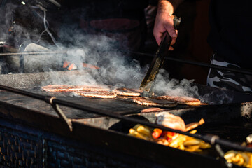 Traditional smoked pork meat products prepared for selling at Christmas market in Bucharest.