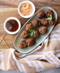 Mini beef frikkadels. Traditional South African meatballs made with mince, bread, spices, eggs and onion 
