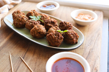 Mini beef frikkadels. Traditional South African meatballs made with mince, bread, spices, eggs and onion 