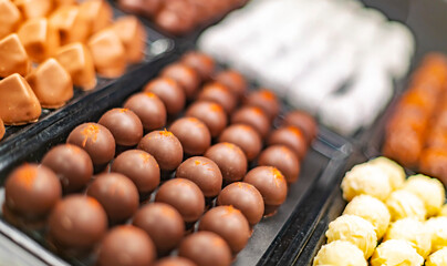 Chocolate pralines displayed in a confectionery store