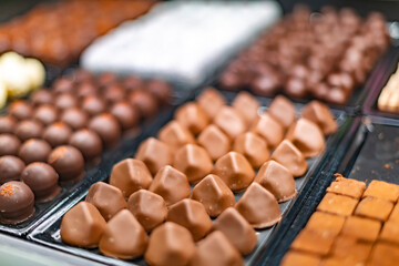 Chocolate pralines displayed in a confectionery store