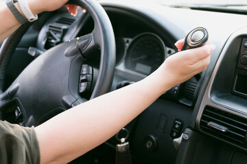 Naklejka premium Driver hold on to the shift lever of the automatic transmission on the wheel