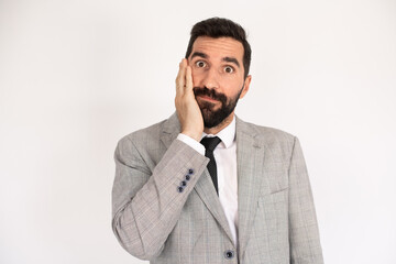 Portrait of astonished bearded man. Male in suit gesturing with surprise. Portrait, emotion concept