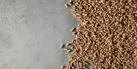 Top view of heap of natural brown fuel pellets scattered with copyspace