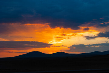 Sunset or sunrise over the mountain and cloudy sky. Inspirational background