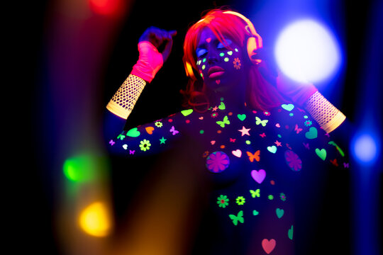 Female dancer in glow UV costume