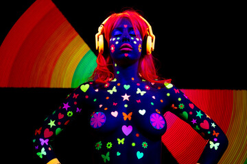 Fototapeta na wymiar Female dancer in glow UV costume