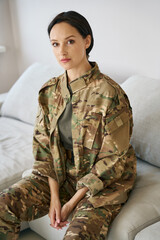 Fototapeta premium Pretty military woman in a bright room