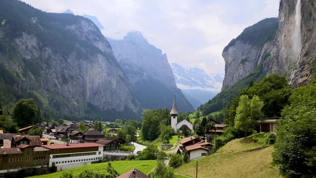 Famous Lauterbrunnen town and Staubbach waterfall, Bernese Oberland, Switzerland, Europe. Lauterbrunnen valley, Village of Lauterbrunnen, the Staubbach Fall, and the Lauterbrunnen Wall in Swiss Alps.