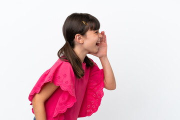 Little caucasian kid isolated on white background shouting with mouth wide open to the side