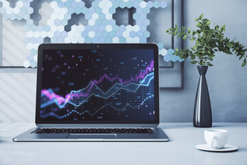 Close up of laptop with abstract glowing candlestick forex chart with index and grid on modern workplace backdrop with coffee cup. Invest, trade, finance ans stock market concept. 3D Rendering.