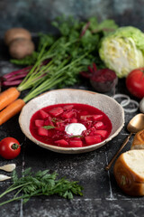Ukrainian borsch with ingredients. Fresh peeled vegetables and ribs, ingredients for borsch soup. banner, menu, recipe.