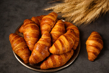 crispy croissants on a large tray