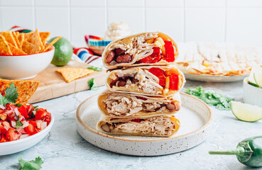 Burritos wraps with mincemeat, beans and vegetables. Mexican dish