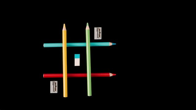 Game Iks Oks, wooden colored pencils, cutter, eraser. , concept of going to school, on black background, video animation 4K