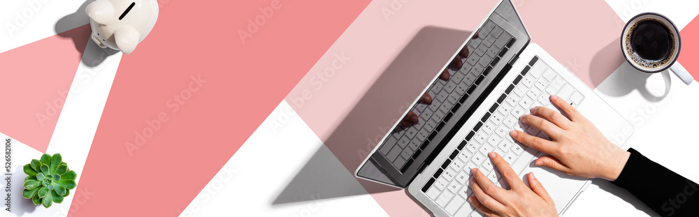Poster person using a laptop computer from above
