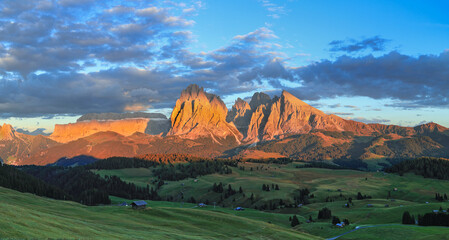 Sunset over the Alpe di Siusi - Seiser Alm with Sassolungo - Langkofel mountain group in...