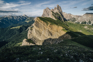 Amazing views of the Dolomites mountain landscape. Sunset view from Seceda over to the Odle mountains. Spectacular dolomitean landscape, Tyrol, Italy.