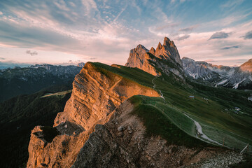 Amazing views of the Dolomites mountain landscape. Sunset view from Seceda over to the Odle mountains. Spectacular dolomitean landscape, Tyrol, Italy.