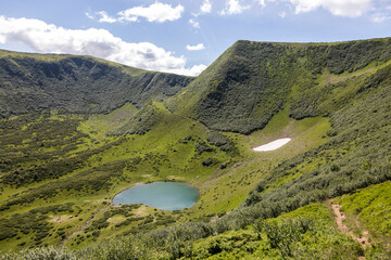 View from above of mountain lake Vorozheska surrounded by mountains