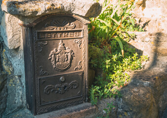 Old mailbox in an old french town. Vintage. Antic mailbox
