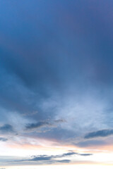 Naklejka na ściany i meble Beautiful sky at sunset. Vertical snapshot