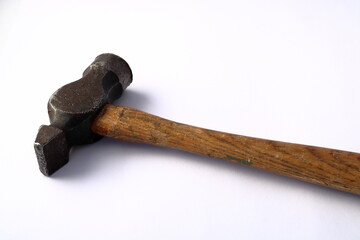 Old wooden hammer. Close up and isolated against a white background. 