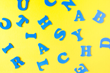 Colored letters of the alphabet on a yellow background. Educational game. learning through play.