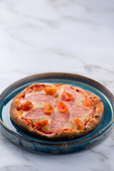 Pizzete. Home baked mini pizzas with ham, cheese. Italian cuisine