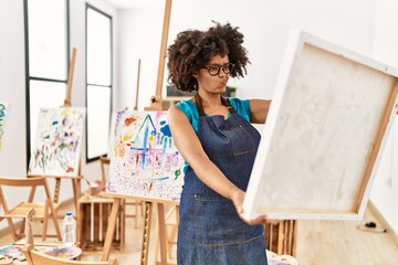 Young african american woman looking draw at art studio