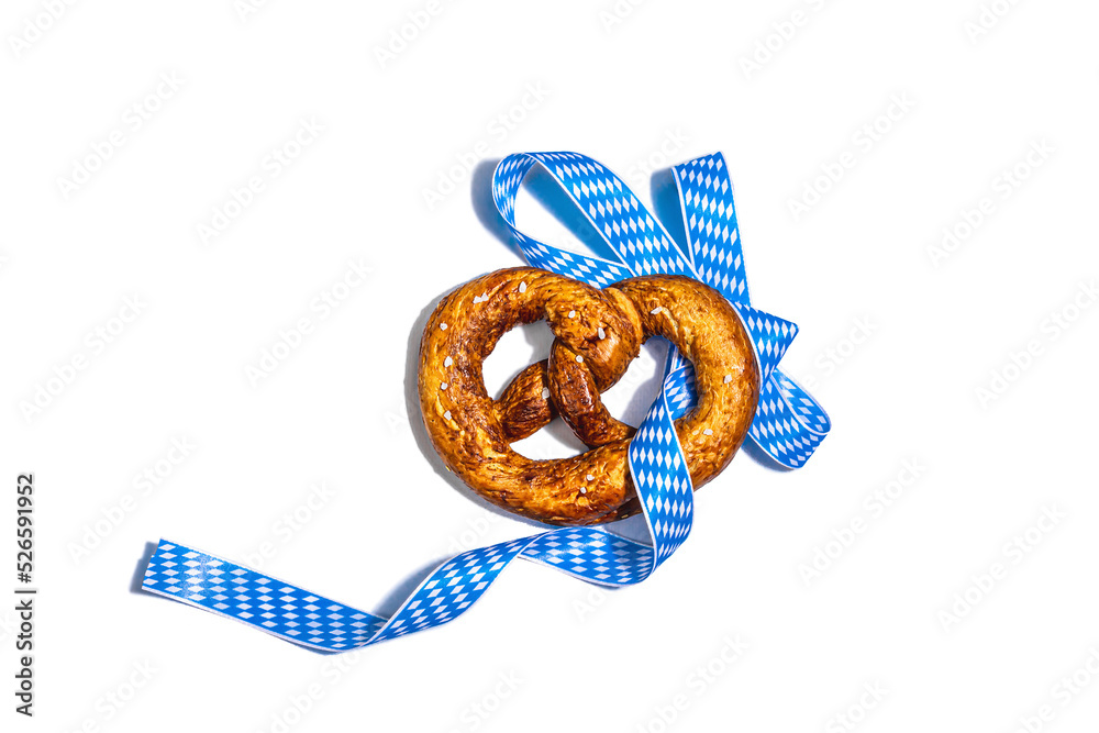 Wall mural Oktoberfest concept - pretzels on a traditional napkin isolated on white background