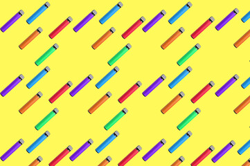 Many electronic cigarettes on yellow background. Pattern for design