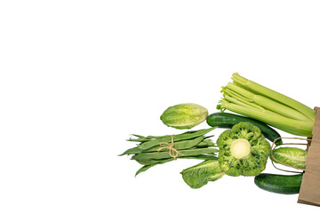 Green colored vegetables flying from the kraft paper bag isolated transparent png