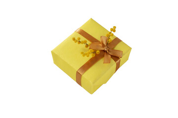 Spring holidays gift box with golden ribbon bow and mimosa flowers isolated transparent png. Present wrapped with yellow paper.