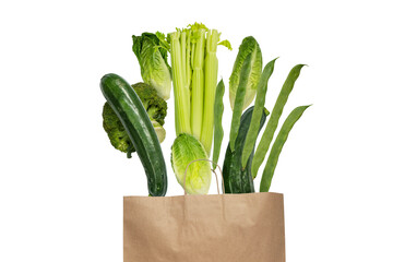 Green colored vegetables flying from the kraft paper shopping bag isolated transparent png