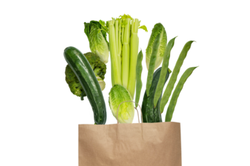 Green colored vegetables flying from the kraft paper shopping bag isolated transparent png