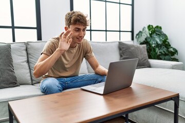 Young caucasian man smiling confident having video call at home