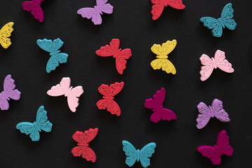 Colored figures in the form of butterfly on a black background