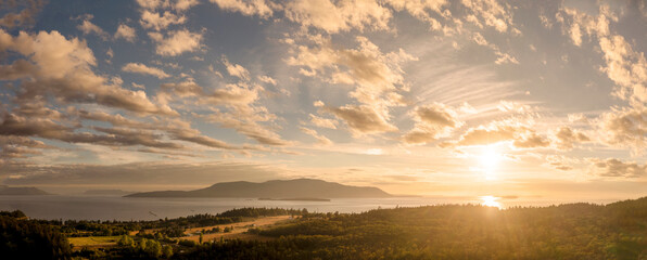 Sunset View of Orcas Island, Washington. A beautiful aerial look at a summer cloudscape over Orcas...