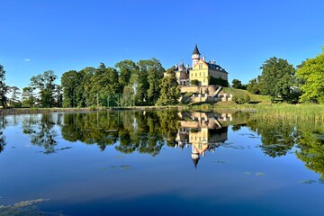 Fototapeta na wymiar Radun empire style castle and the lake