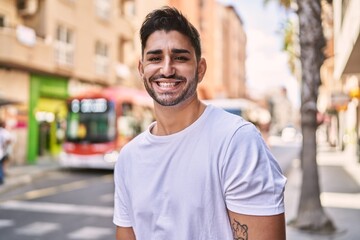 Fototapeta premium Handsome hispanic man smiling happy outdoors