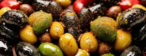 Different types of tasty olives as background, closeup