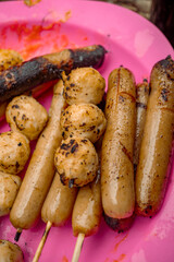 Close up photo of sausage barbeque when summer time holiday. The photo is perfect for family holidays poster, holiday background and food advertising.   