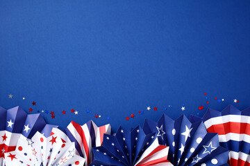 Paper fans in color of American flag on dark blue background. Happy American Independence Day, USA...