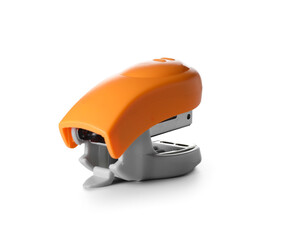 Modern orange stapler on white background