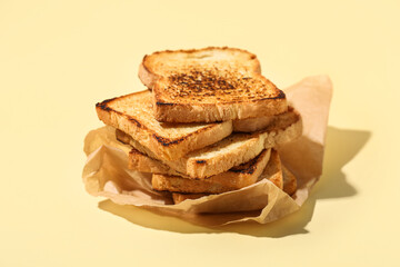 Stack of toasts on color background