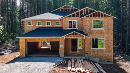 Approaching a modern suburban home in mid construction phase, 4k dolly zoom.