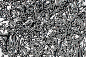 black white building supply materials workshop steel nails white overhead table nail pile background backdrop sales studio working construction display