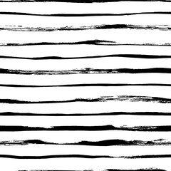 Seamless pattern with thin brush lines. Black and white seamless vector sailor stripes pattern. Classic black and white hand drawn stripes ornament. Simple horizontal lines. Tribal or ethnic ornament